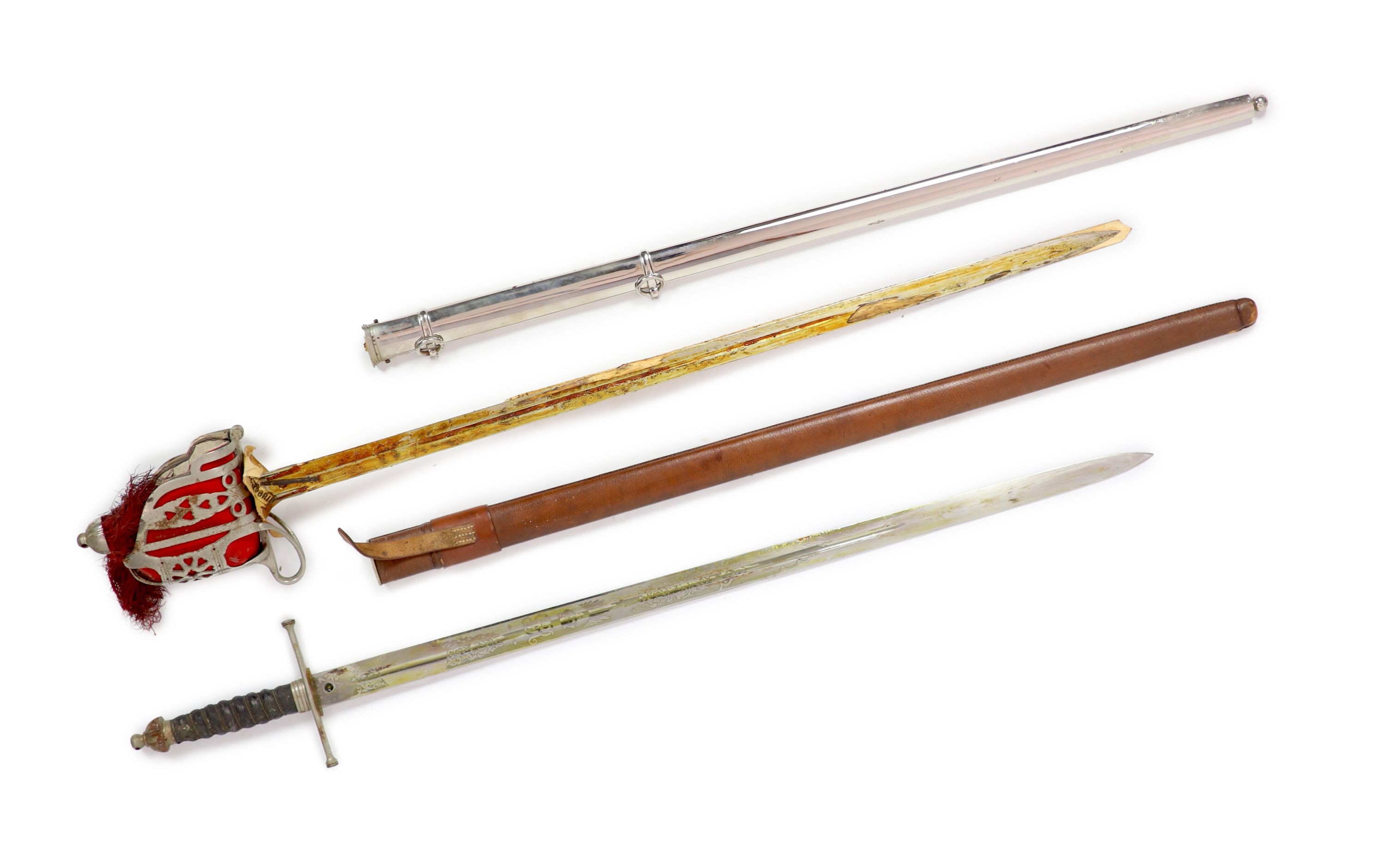 A George V Scottish Queen’s Own Cameron Highlanders basket hilted Claymore and a similar broad sword, (2)